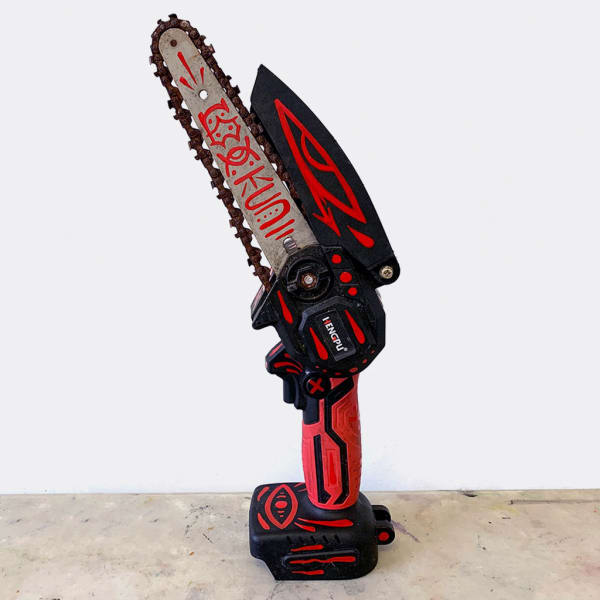 GATS God of Dreams, 2025 enamel on chainsaw 14 1/4 x 4 1/2 x 6 1/2 in 36.2 x 11.4 x 16.5 cm