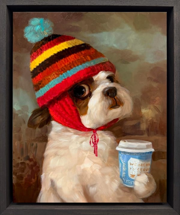 dog holding a coffee cup wearing a multicolor striped beanie