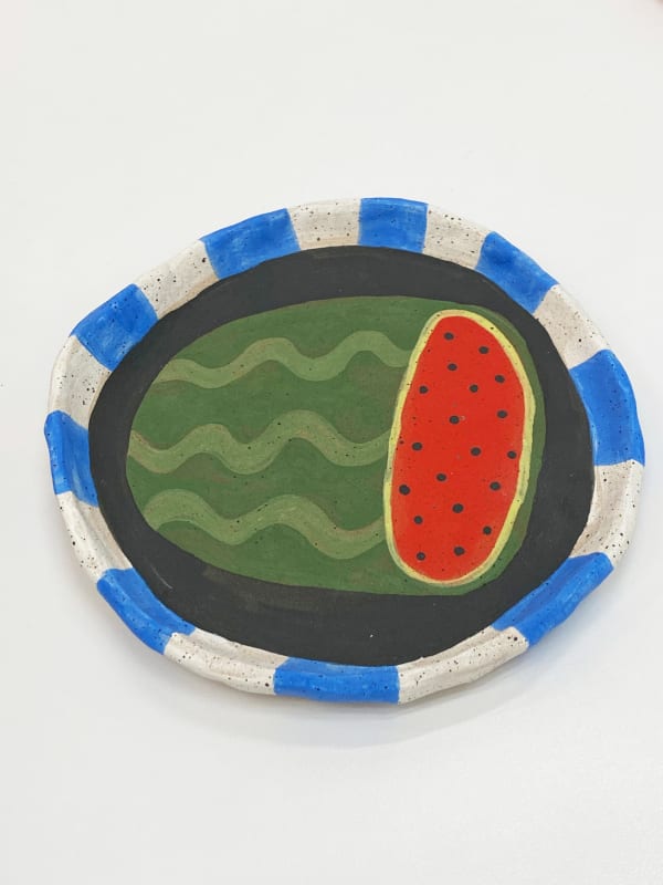 Jackie Brown ceramic plate of a watermelon with white and blue striped border