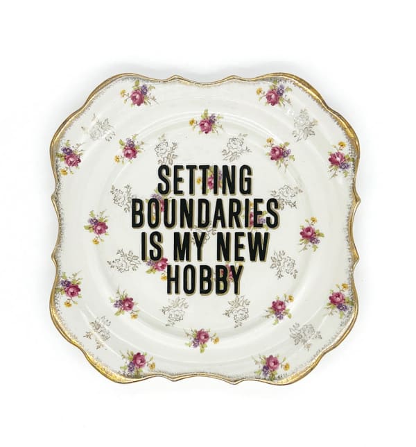 ceramic plates with words painted on them