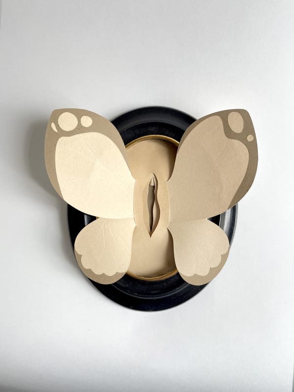 paper sculpture of a vulva with butterfly wings