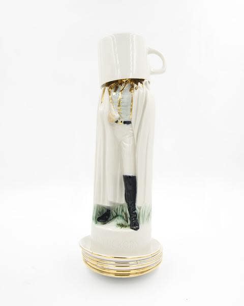 Jeremiah Jenkins scupture of figure in black boots and all white outfit with oversized teacup covering their head