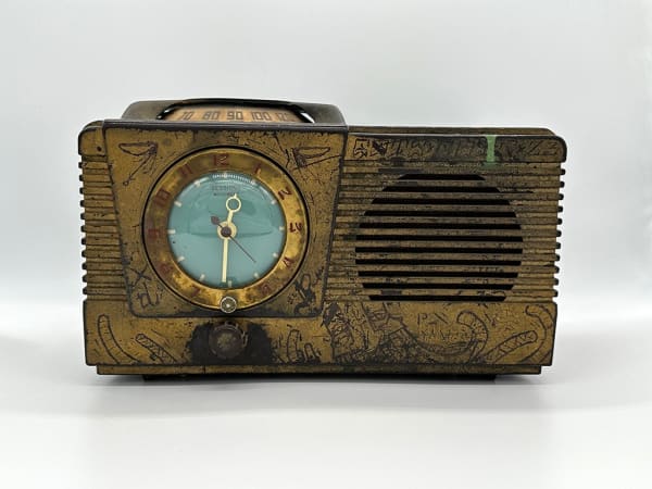 front of antique radio decorated by GATS
