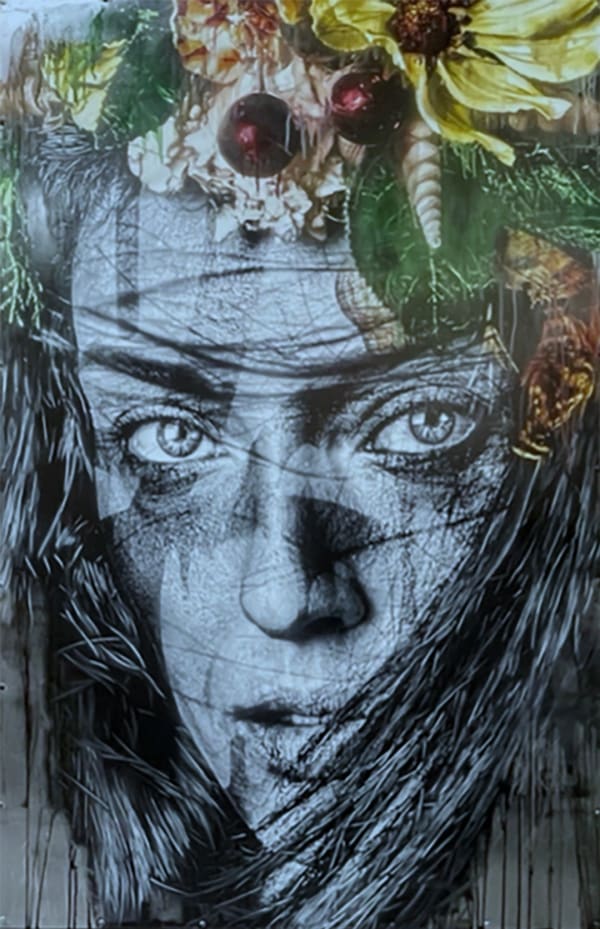 woman's face over a silver background with yellow flowers in her hair