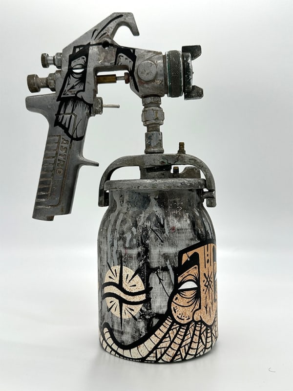 metal spray paint can decorated with GATS symbols
