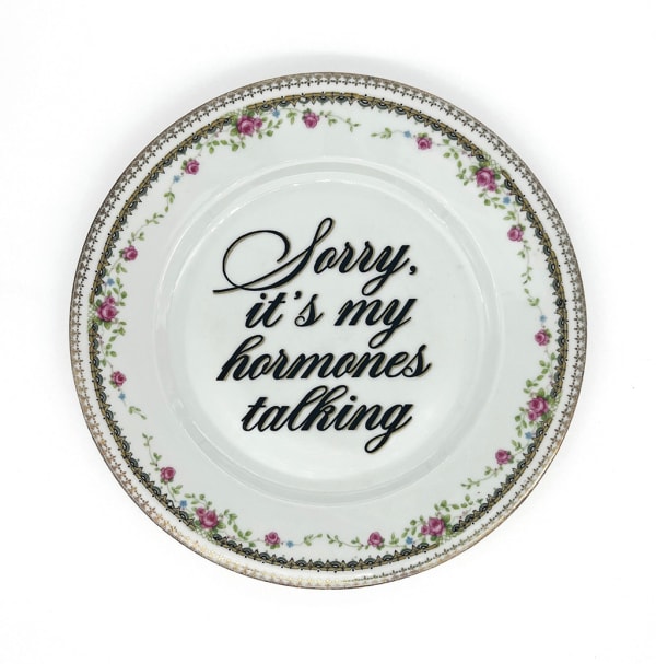 ceramic plates with words painted on them