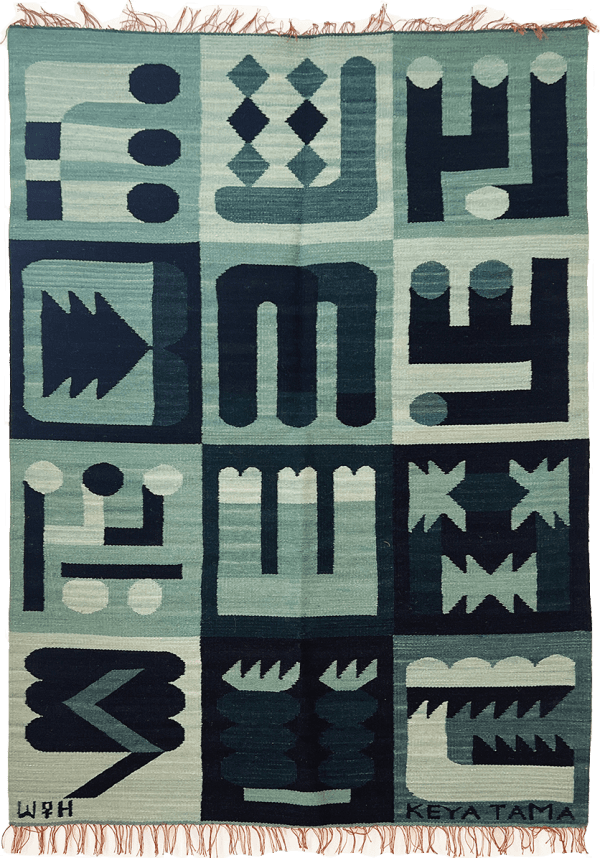 green knit rug decorated with 12 abstract symbols in a grid