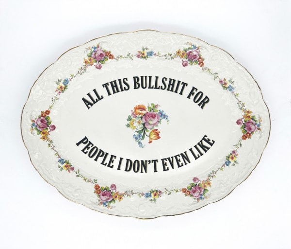 ceramic plates with words painted on them