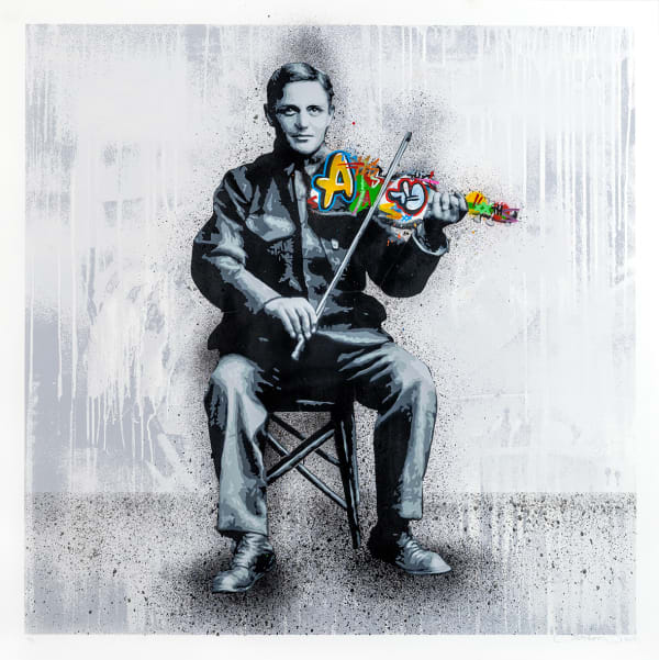 black and white man seated playing a fiddle made from colorful graffitti