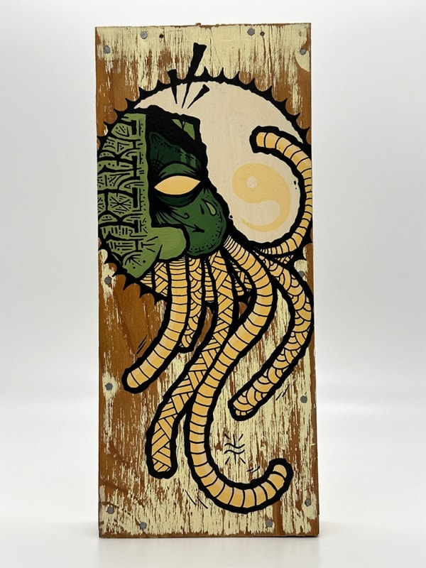 wooden panel painted with GATS mask peaking through a hole