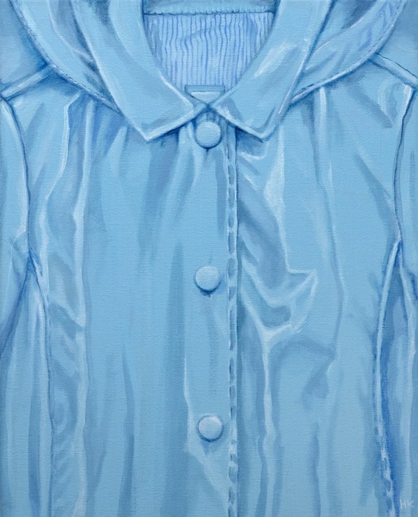 close up paint of a crinkled blue raincoat