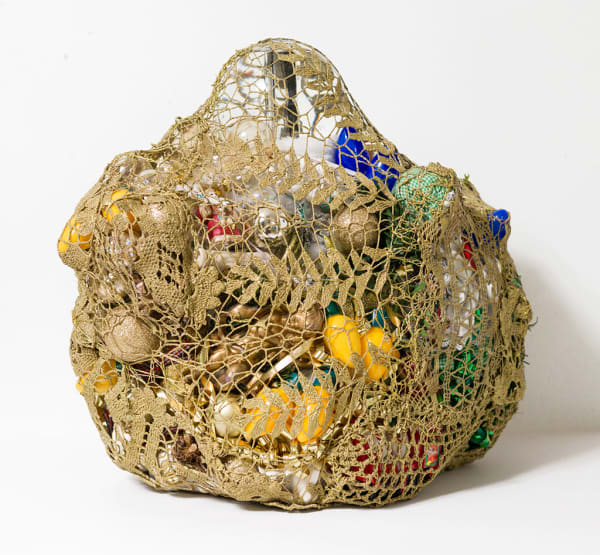 crocheted net covering found objects