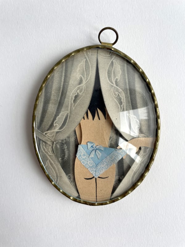 paper sculpture of a woman in blue underwear with curtains on either side of her
