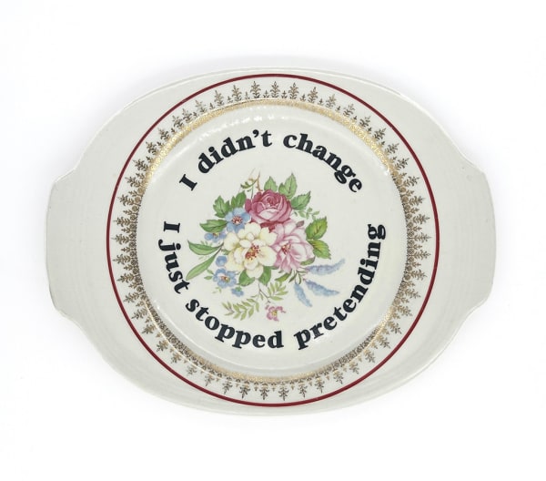 ceramic plates with words painted on them