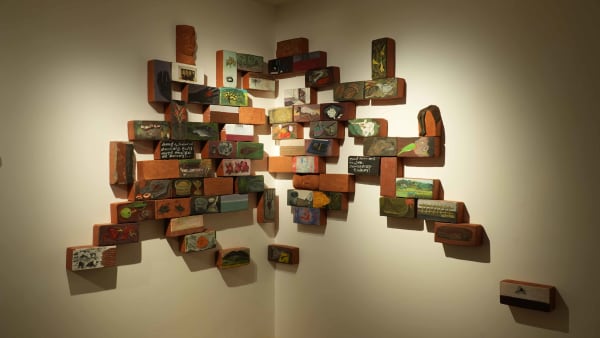 Unnikrishnan C Untitled , 2025 Acrylic on terracotta, carvings, text 60 x 95 in 152.4 x 241.3 cm
