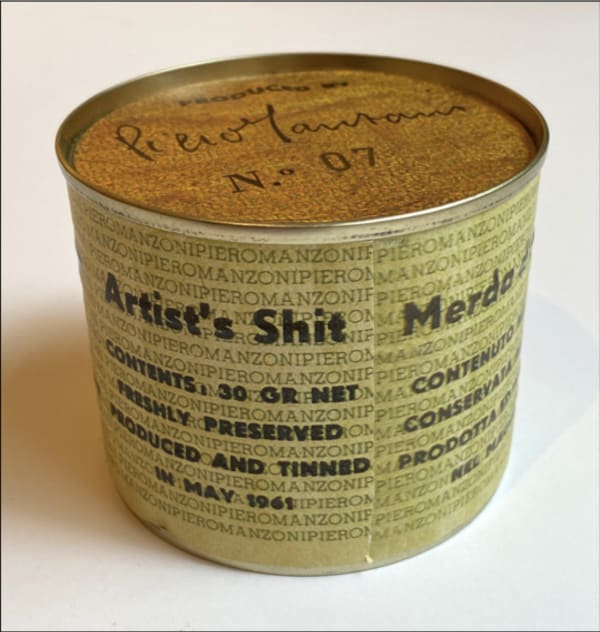 A can that reads "artist's shit"