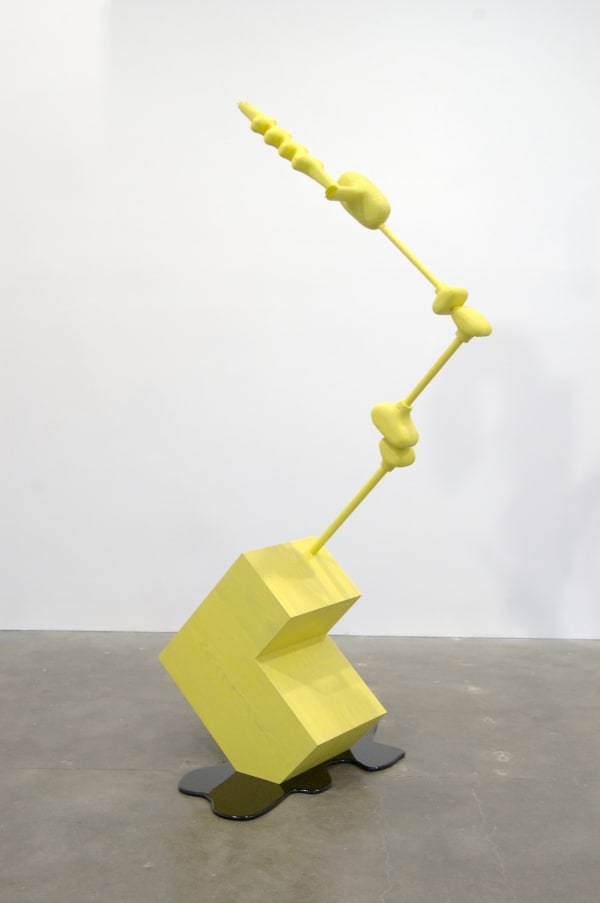 Carved wood abstraction stained yellow, stepped shape with long zig-zag extension sitting in brown carved wood puddle