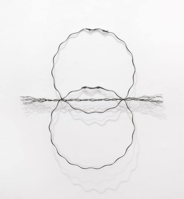 Two over lapping circles with a wire rope between them