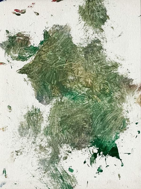 Green splotches of paint on white canvas