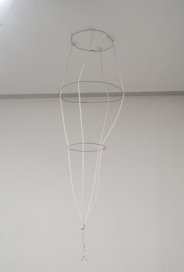 Rope and wire vessel hanging from ceiling