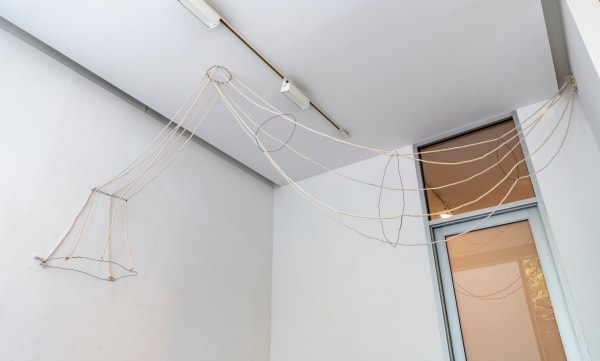 Rope and wire vessel hanging from ceiling