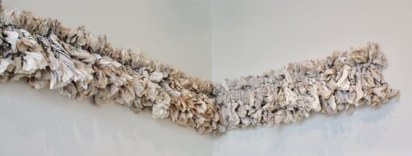 A frieze made from twisted newspapers