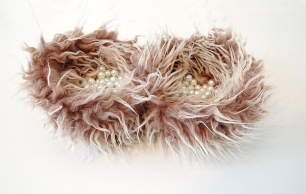 Faux fur holding pearls