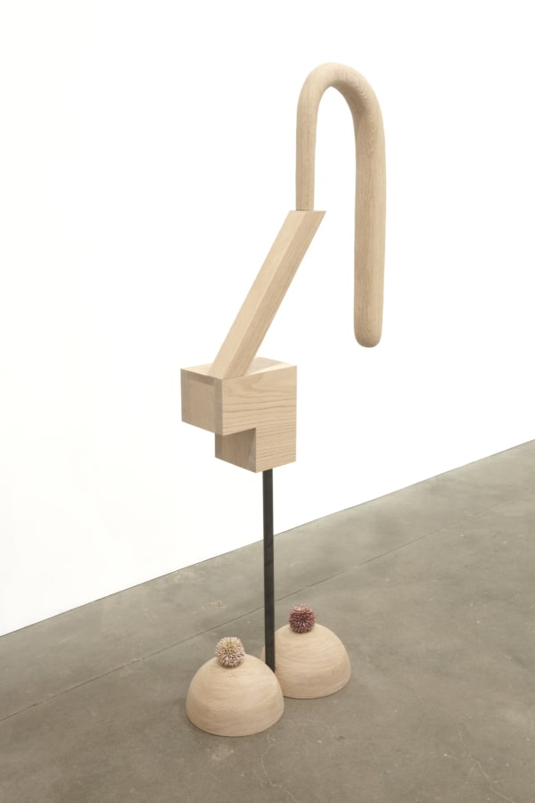 Carved wood abstraction of blonde wood, two semicircles with white flowers serve as base, rod carries abstract shape of same material with long U-shape extension