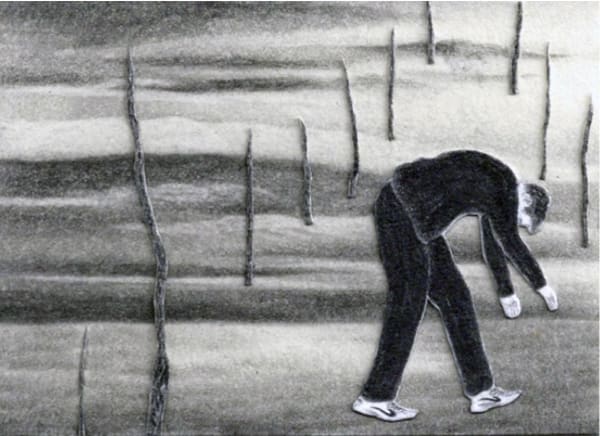 A man hunches over in a landscape