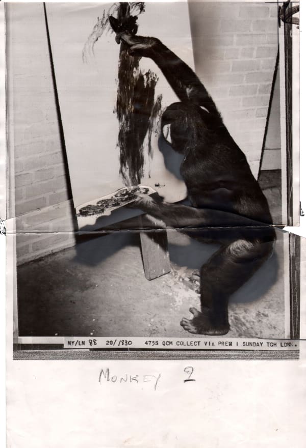 Black and white photograph of monkey painting