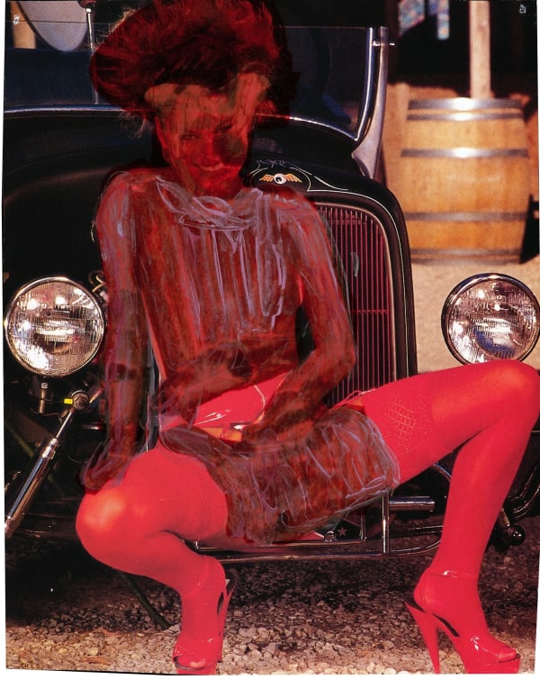 Pornographic image from magazine, obscured by brown and red paint