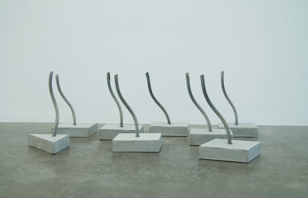 Various shaped concrete slabs with metal wire poking out