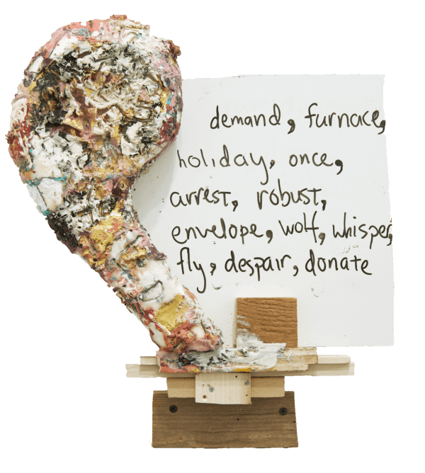 Wall hanging sculptural work composed of a dry erase board with text, wood components and a large club like shape with layers of wax and paint