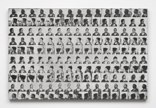a grid of faces in black and white on a panel