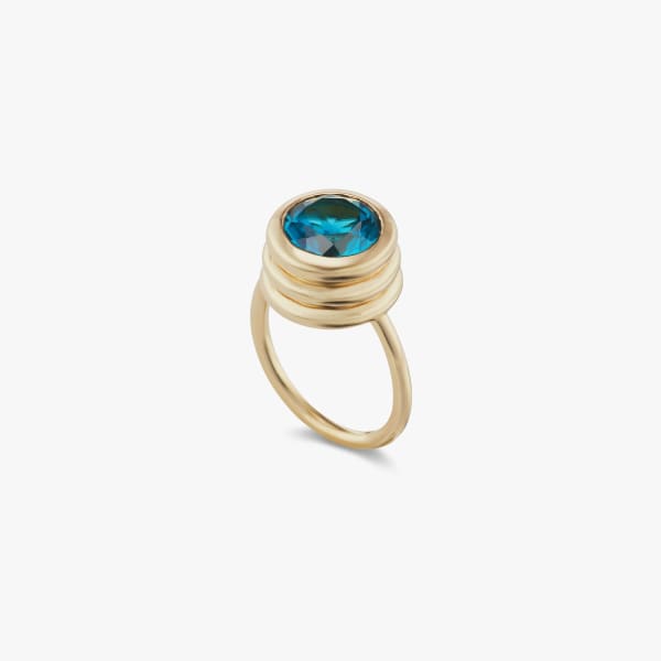 BECK, Groto ring with blue topaz