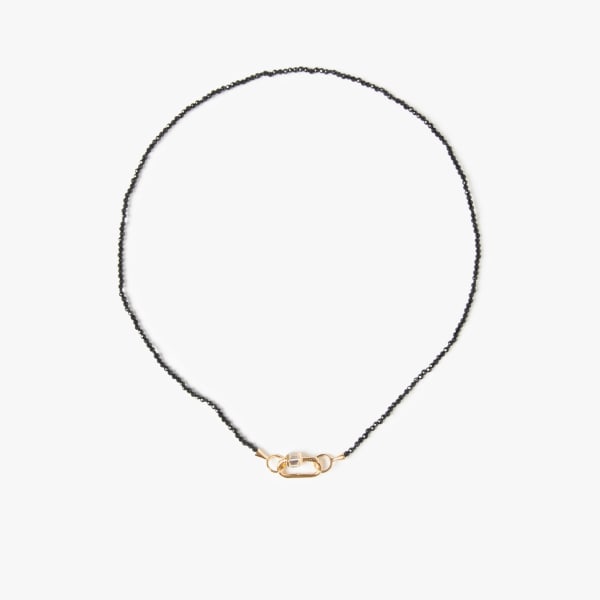 Marla Aaron, Itty bitty black spinel strand