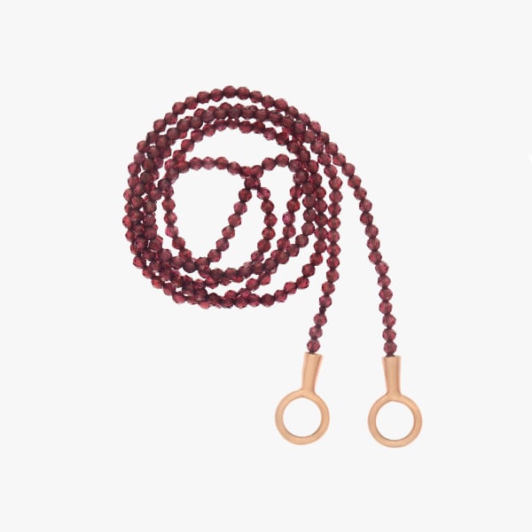 Marla Aaron, Itty bitty garnet strand