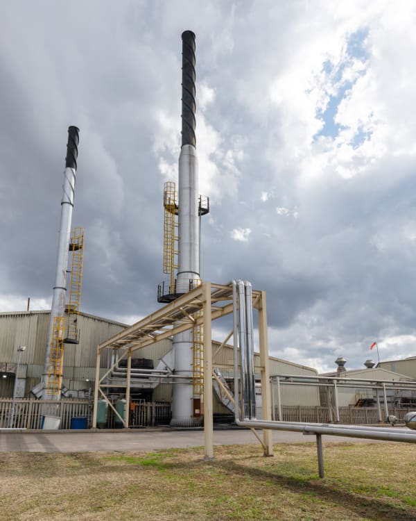 Reaching for the sky, the giant towers of Babelegi point the way to a cleaner, greener tomorrow. By capturing carbon during the final stages of production, the plant is pioneering a process of REduction, REcycling, and REpurposing that is setting a benchmark of best practice for the world.