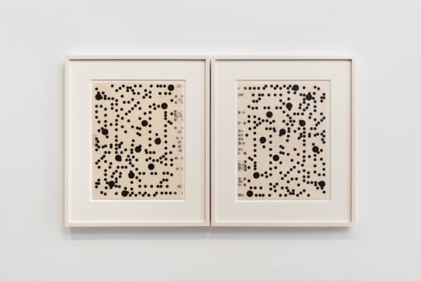 an abstract work on paper with black dots