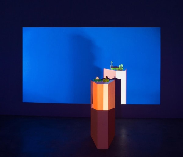 Lena Daly Ambient Trix, 2016 Video and Ultrasound projection, wood pedestal, UV-reactive paint, uranium glass, UV-reactive water, HD projector, HSS speaker and UV light Video duration: 5 min. Pedestal: 36 x 16 x 21 12.7 x 0.0 cm