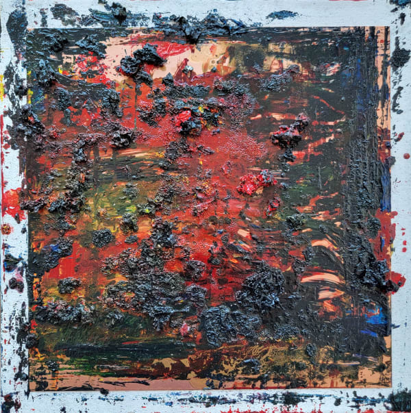 Abstract painting with heavy texture and a white boarder with paint of various reds, blues, and yellow splattered outside of the boarder