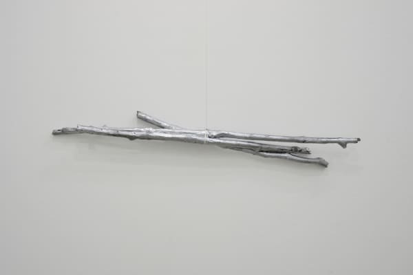 Jon Cuyson Untitled TDS (Silver Sticks), 2025 Nylon string, metal hook, acrylic, aerosol spray on cast resin Variable dimensions