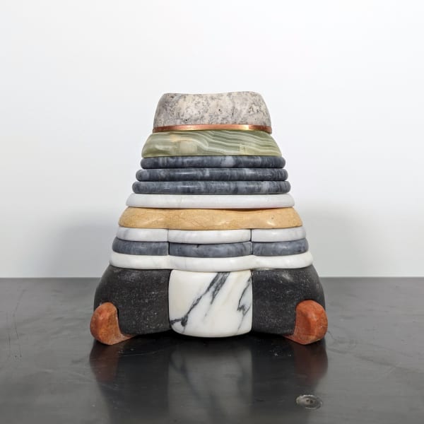 Triangular multilayer sculpture with black, marble, yellow, and green, with a thin brass layer and spotted, thick top