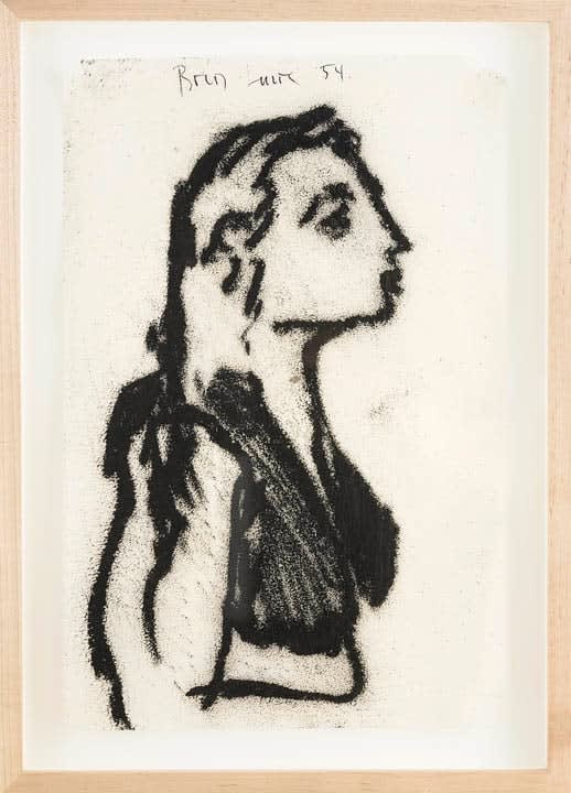 Framed charcoal drawing of a seated young woman in profile