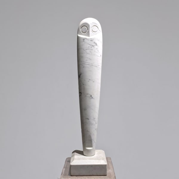 Modernist white marble sculpture of vertical owl with stylized eyes and head, on white marble base