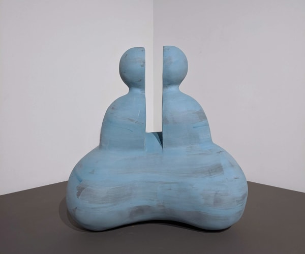 Light blue stoneware sculpture of an abstract bisected humanoid