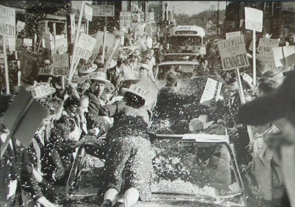 Black and white photograph of a crowd celebrating John F Kennedy's presidential campaign stop in Tazewell, Virginia