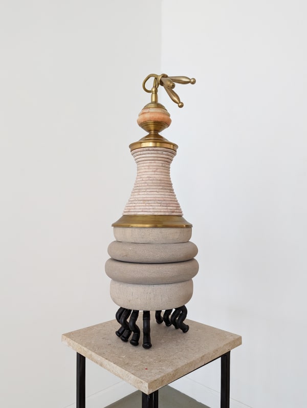 Marble, limestone, and brass sculpture in different layers in gray and neutral tones, supported by black curved legs