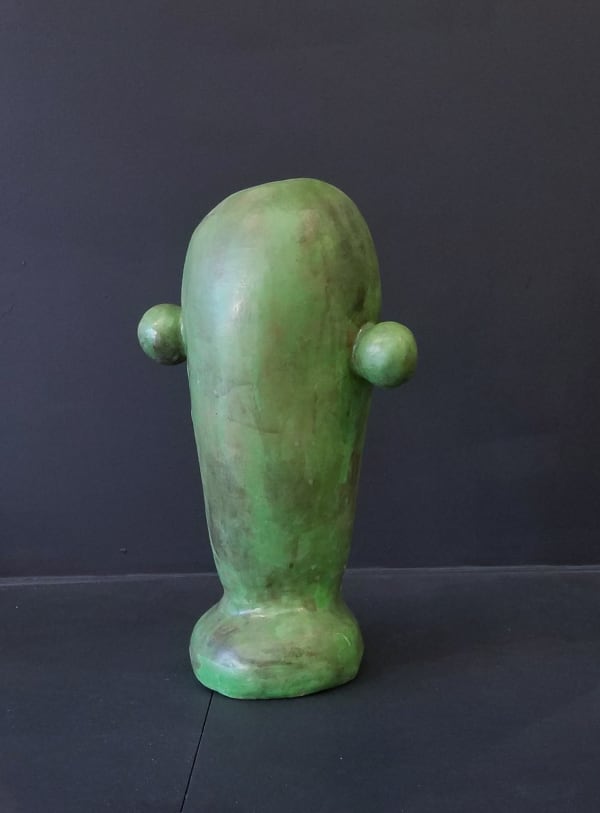 Abstract green porcelain sculpture with two spheres on a flared oblong element