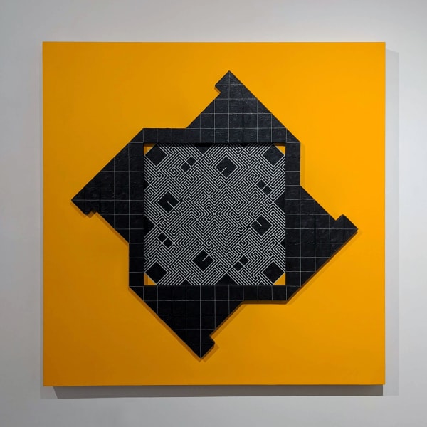 Work on wood of a dark black textured square with an blue edged geometric shape with dark gray labyrinth like lines in the center